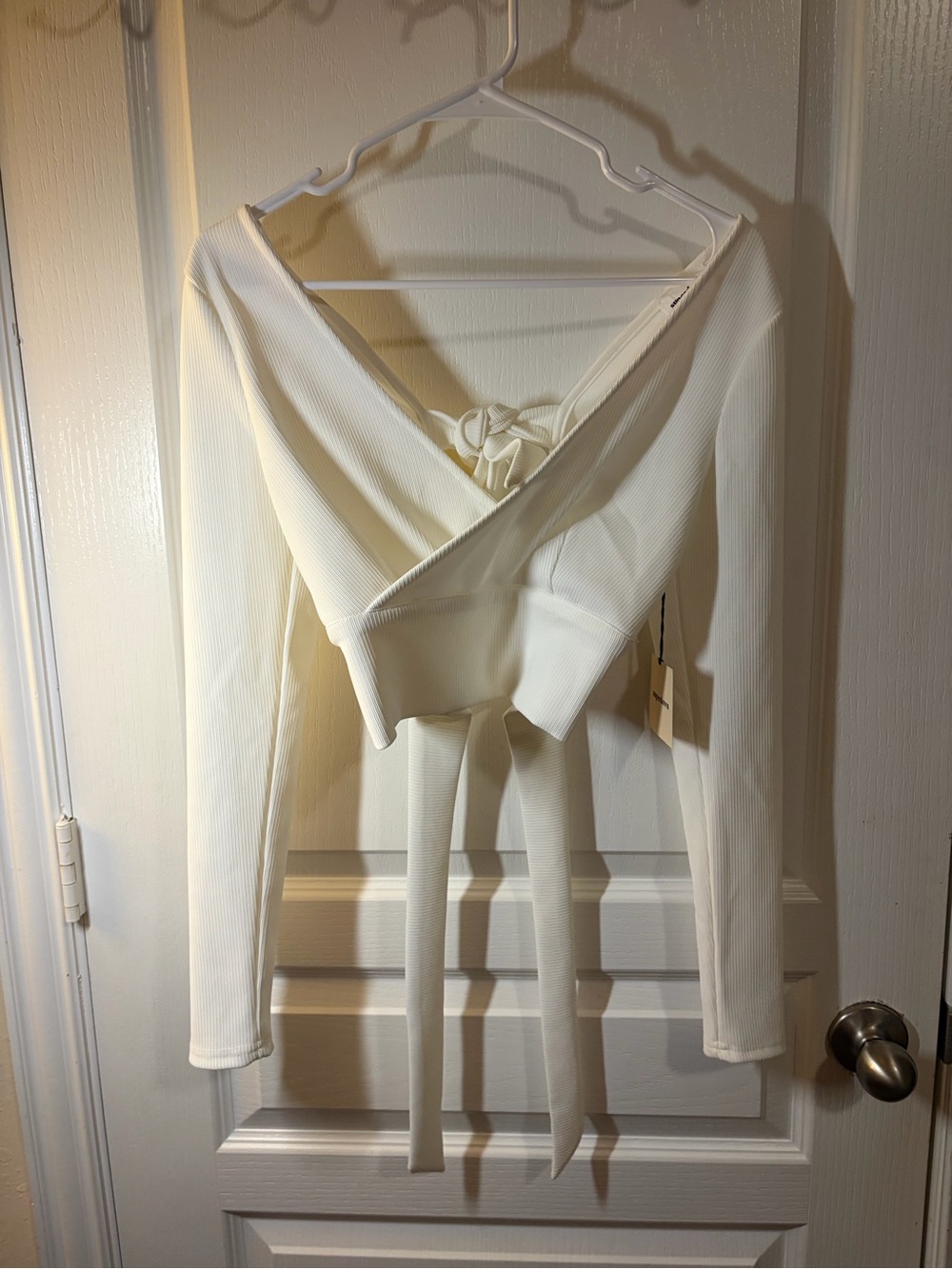 White ribbed top with brand tag